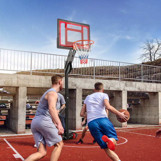 The adjustable basketball hoop is set up on an outdoor court with two men playing basketball