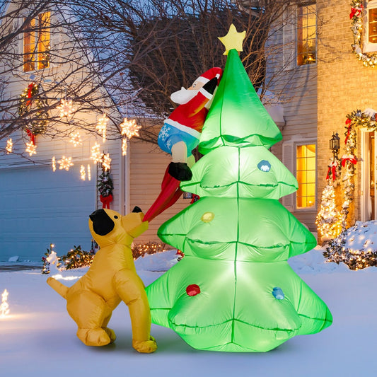 The Christmas inflatable decoration is shown outdoors at night in front of a house decorated for the holidays