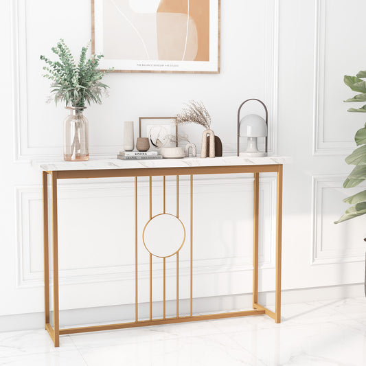 The console table placed against a white wall with decorative vases and a framed picture