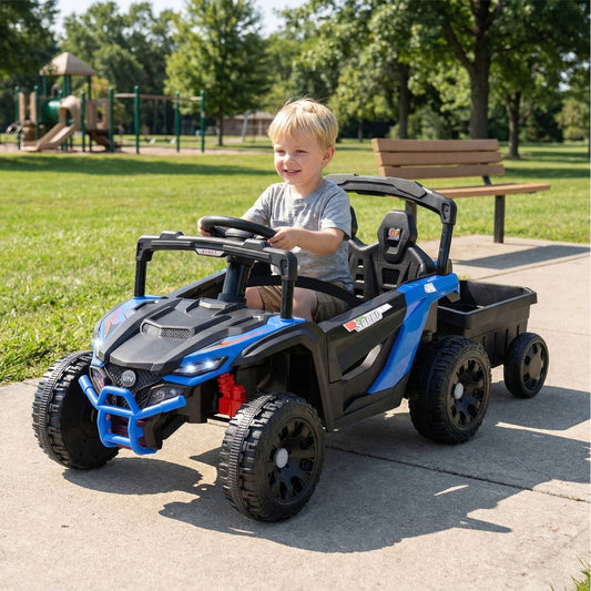 Child driving the kids electric tractor with trailer in a park