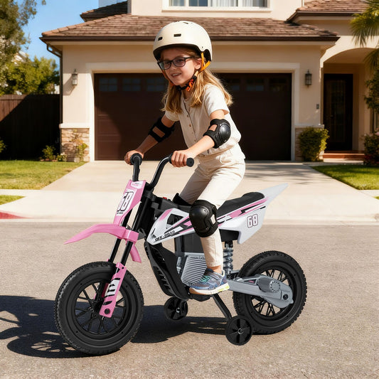 A young girl wearing a helmet and pads riding the pink electric motorbike on a driveway