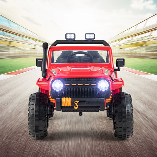 The red kids electric car seen from the front with lights on