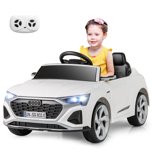 The electric car with a young girl sitting inside and a remote control shown above