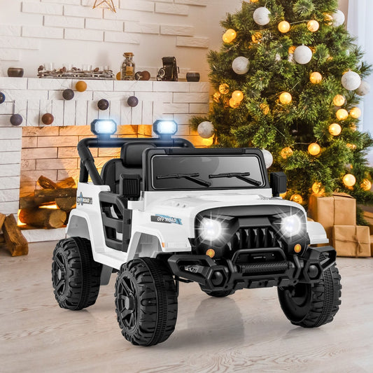 The white kids electric truck parked indoors with a Christmas tree and presents in the background