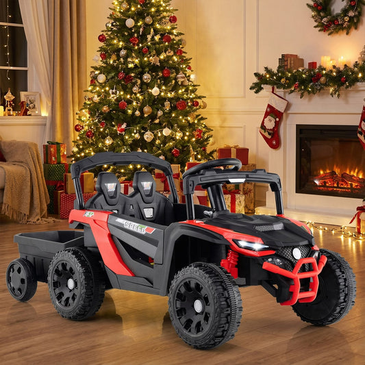 The red kids electric tractor with trailer parked indoors near a Christmas tree