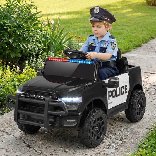 The kids electric car being driven by a child in a police outfit on a garden path