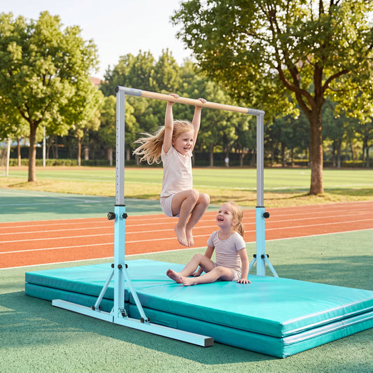 The gymnastics bar set up on a sports field with two children playing on the mat