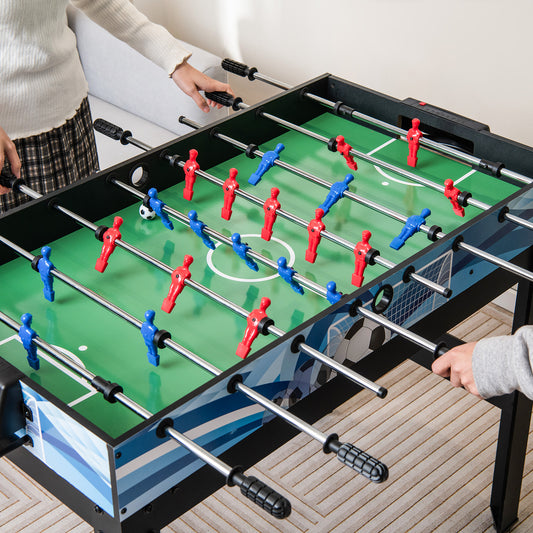 The game table being used for a competitive match of foosball by two people