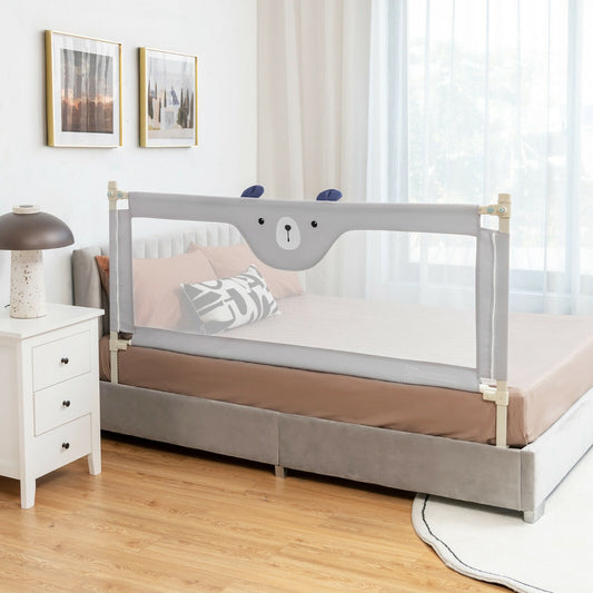 The grey toddler bed rail with a bear face design attached to a double bed