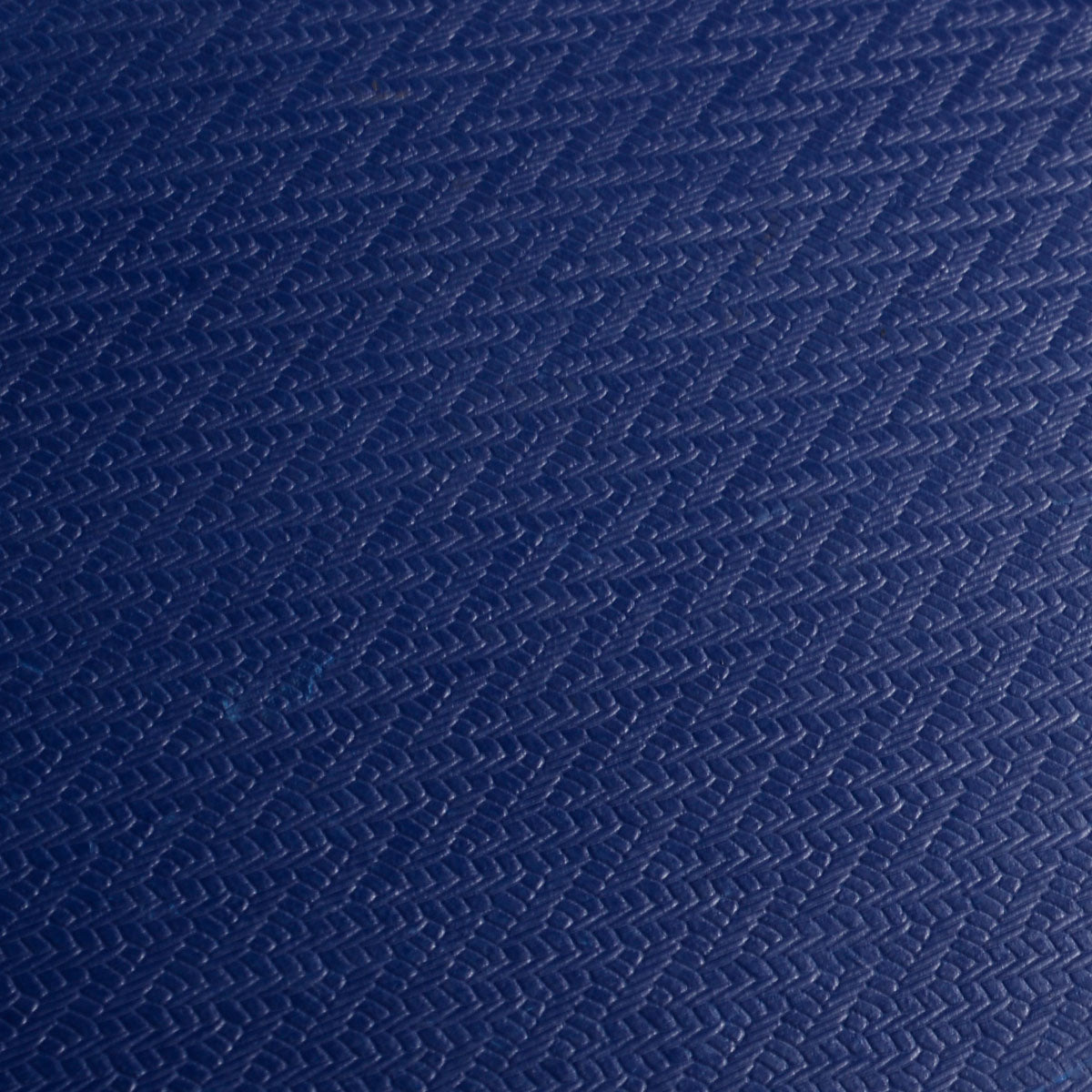 Close-up of the textured blue surface of the platform dolly deck