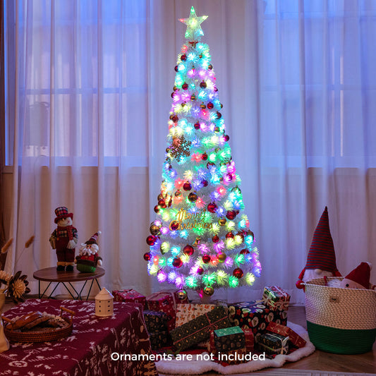 Decorated artificial Christmas tree with baubles and presents in a room