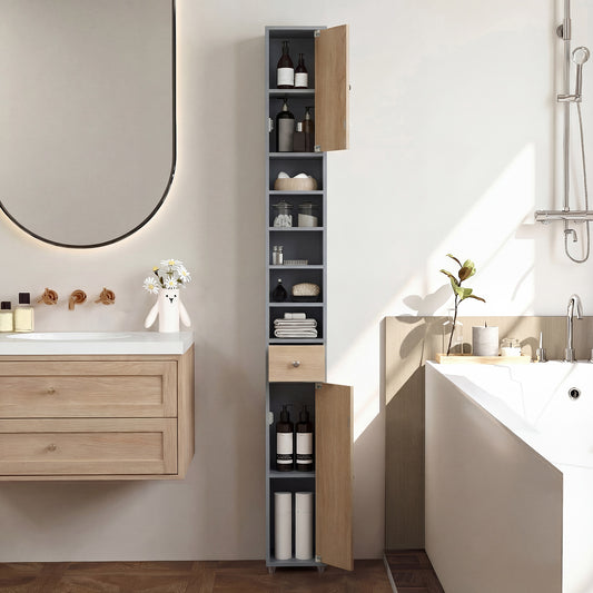 The floor cabinet placed in a modern bathroom next to a bathtub and a wall mirror
