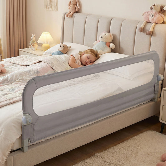 The baby bed rail guard is fitted to a bed with a child sleeping safely
