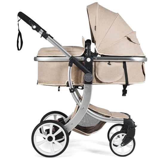 The beige baby stroller with a large canopy and storage basket
