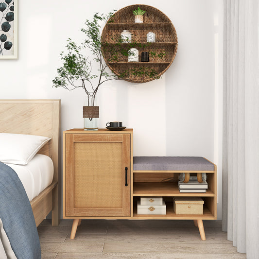 The shoe storage bench with rattan door in a bedroom setting next to a bed