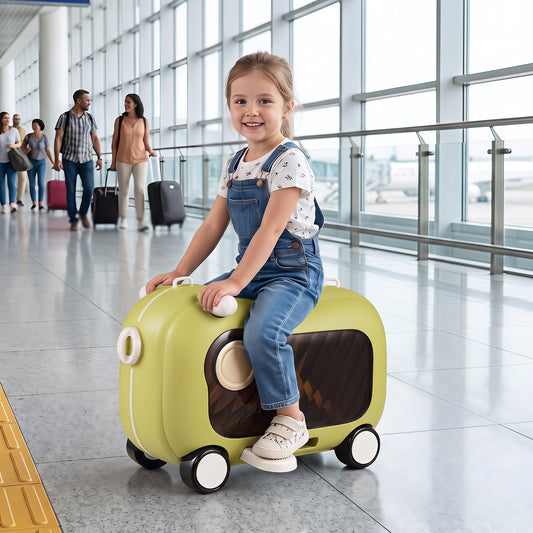 A young girl sits on the green ride-on suitcase in an airport terminal