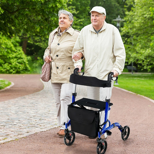 Elderly couple walking outdoors with the blue aluminium mobility walking aid