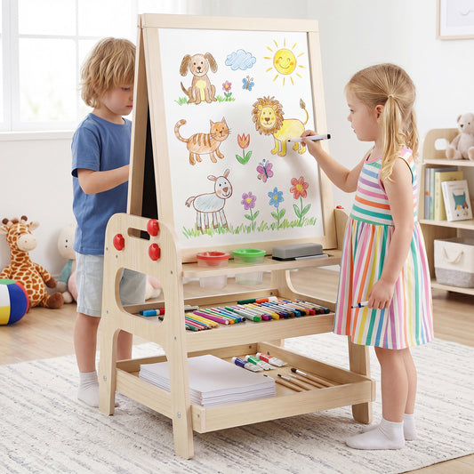Two children drawing and painting on the whiteboard of the wooden easel in a bright room
