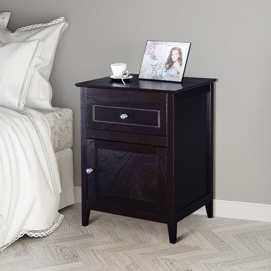The dark wood nightstand placed next to a bed with white bedding in a bedroom setting