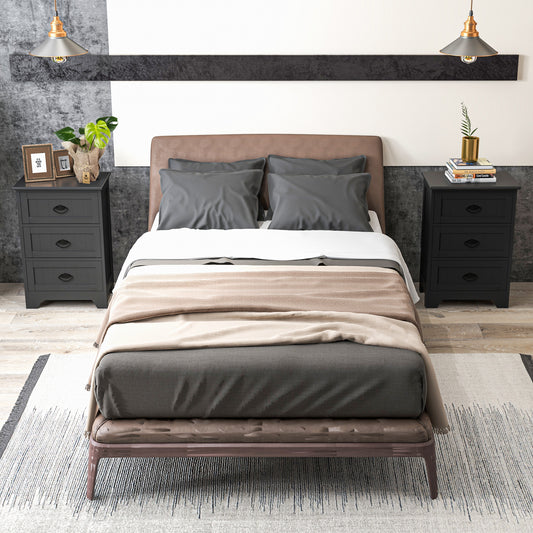 The nightstands placed on either side of a bed in a modern bedroom setting