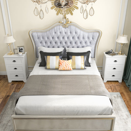 Two white vintage 3-tier nightstands flanking a bed in a bedroom setting