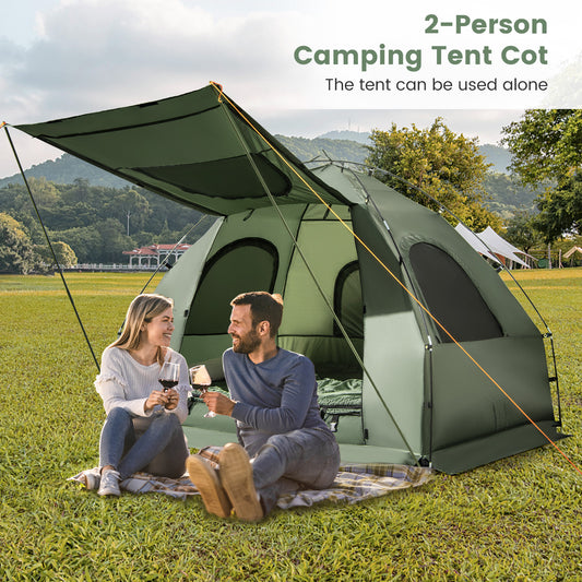 A couple enjoying wine outside the two-person camping tent cot on a sunny day