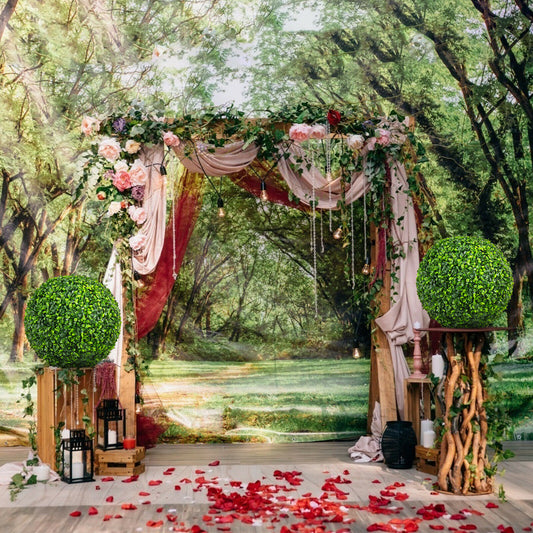Two artificial topiary balls used as decoration at an outdoor wedding arch