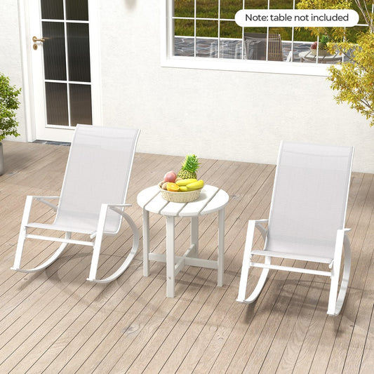 Two grey rocking chairs and a white side table on a wooden deck