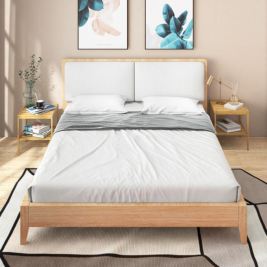 the bamboo nightstands positioned beside a double bed in a bright bedroom