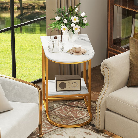 The modern sofa side table is placed next to a sofa with a vase of flowers on top