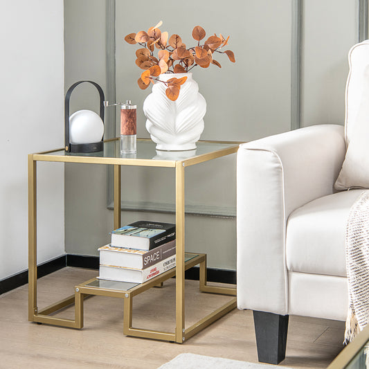 The end table is placed next to a sofa with books and a lamp on top