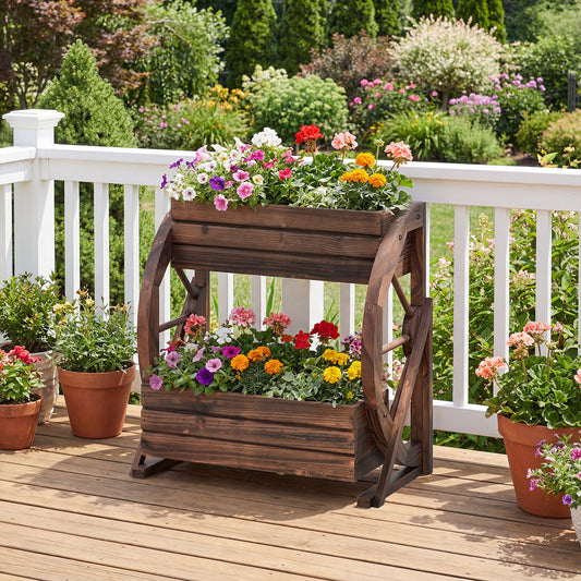 The raised garden bed filled with colourful flowers on a wooden deck
