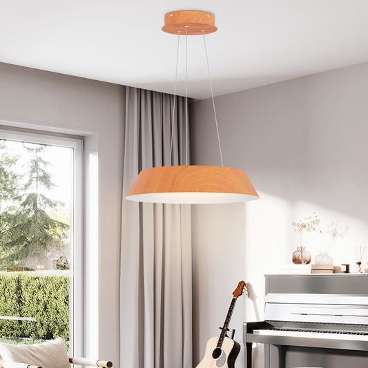 The modern ceiling light hanging above a piano in a bright room with large windows