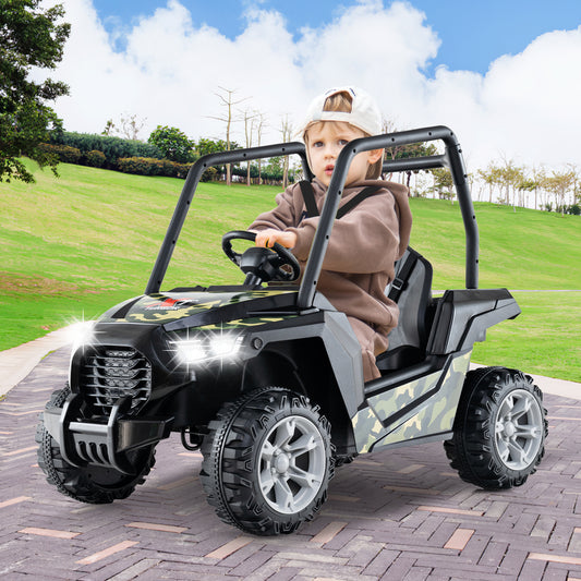 The kids electric car with a camouflage finish and bright front lights on a paved path