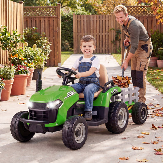 A happy young boy drives the green ride on tractor with trailer in a garden