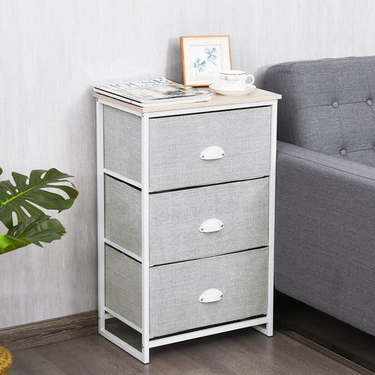 The three-tier fabric storage cabinet next to a sofa and a plant