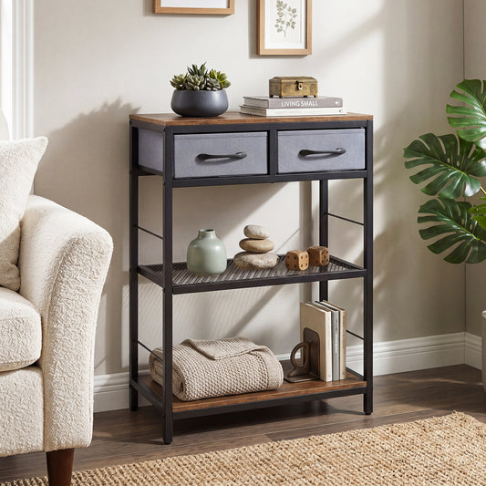 The console table in a living room next to a sofa and a large plant