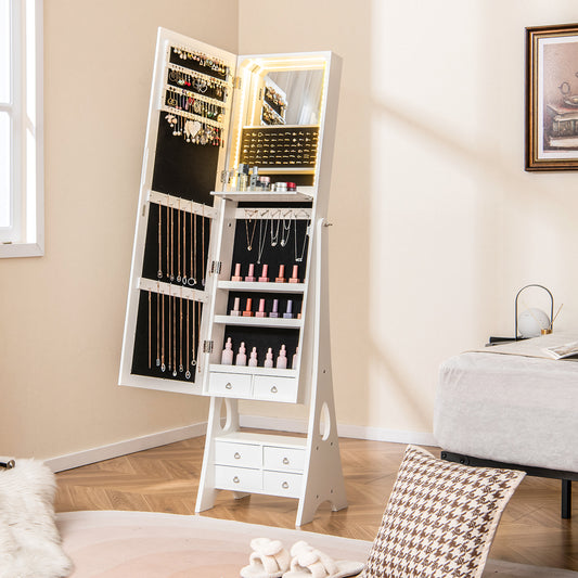 The jewelry armoire stands open in a bedroom with the interior LED lights illuminated