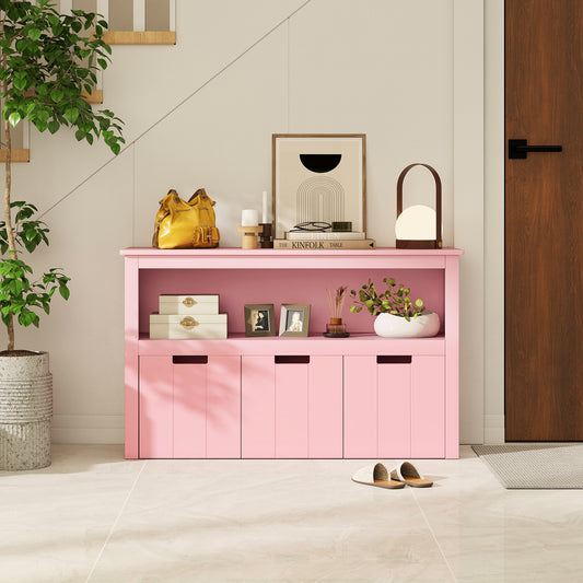 The pink storage unit placed in a hallway with decorative items and books on the open shelf