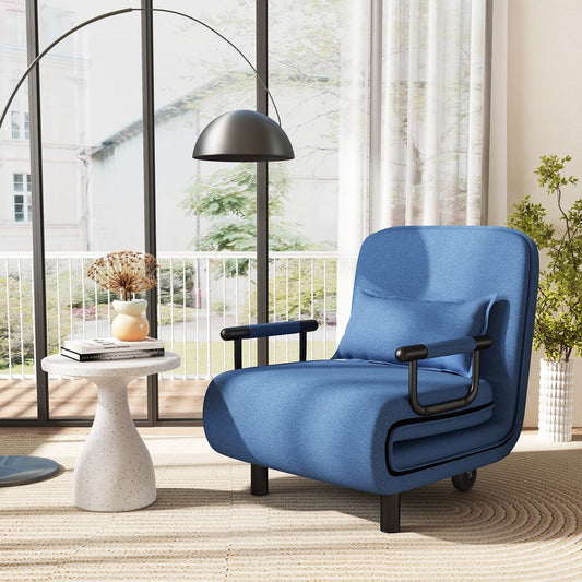 Blue convertible sofa bed in a stylish living room setting next to a side table and a floor lamp