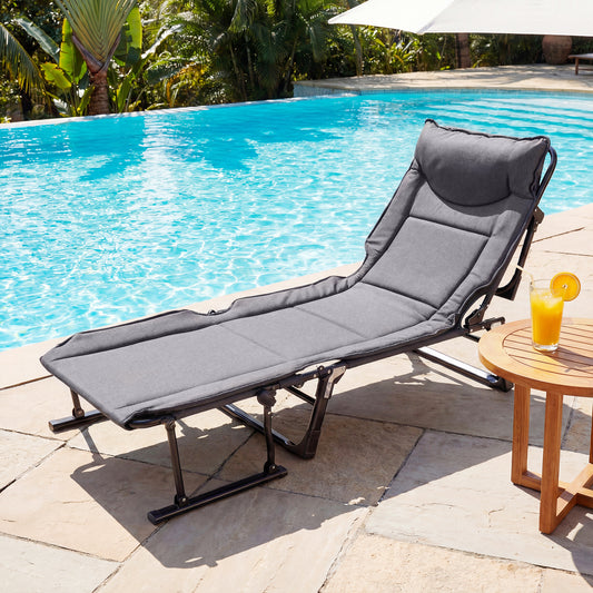 The camping furniture as a sun lounger by a swimming pool