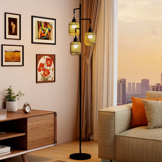 The black floor lamp with three woven lampshades in a living room setting