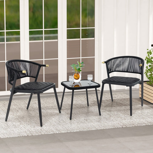 Black wicker chairs and coffee table on a patio with a rug