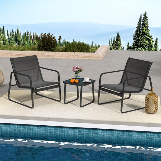 The patio furniture set placed on a terrace overlooking a scenic mountain landscape by a pool