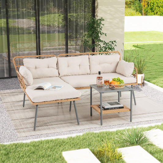 The patio furniture set placed on a patio rug with a drink and fruit bowl on the table