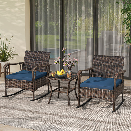The navy blue patio furniture set with two rocking chairs and a table on a tiled patio