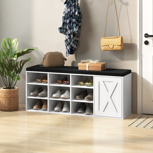 The shoe rack bench with a black cushion is placed in a hallway with shoes on the shelves and a bag hanging above