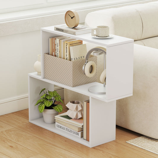 The white wooden bookcase is shown next to a sofa, holding books and headphones