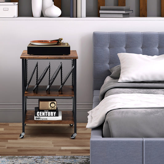 The end table placed next to a bed with a record player and books on the shelves