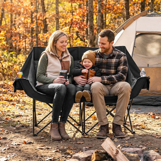 A family enjoying the camping furniture in a woodland setting